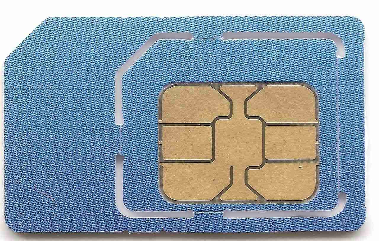 A close-up image of a blue sim card detached from its credit card-sized holder. sim card deals